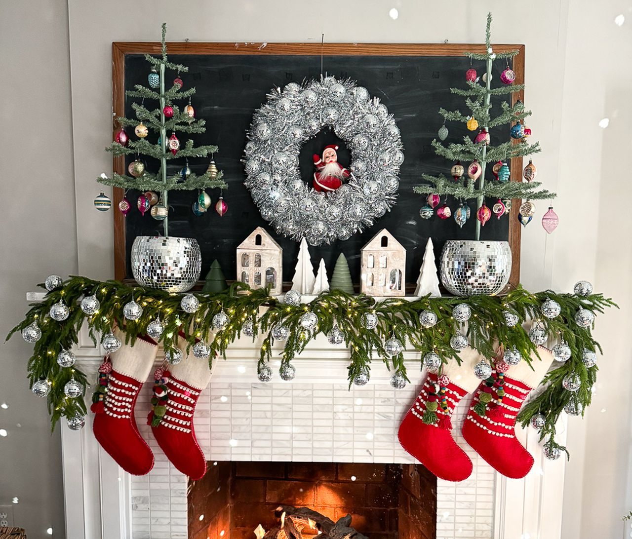 Traditional Fireplace Mantel with Santa Wreath and Striped Stockings Traditional Fireplace Mantel with Santa Wreath and Striped Stockings — christmas decor trends 2026