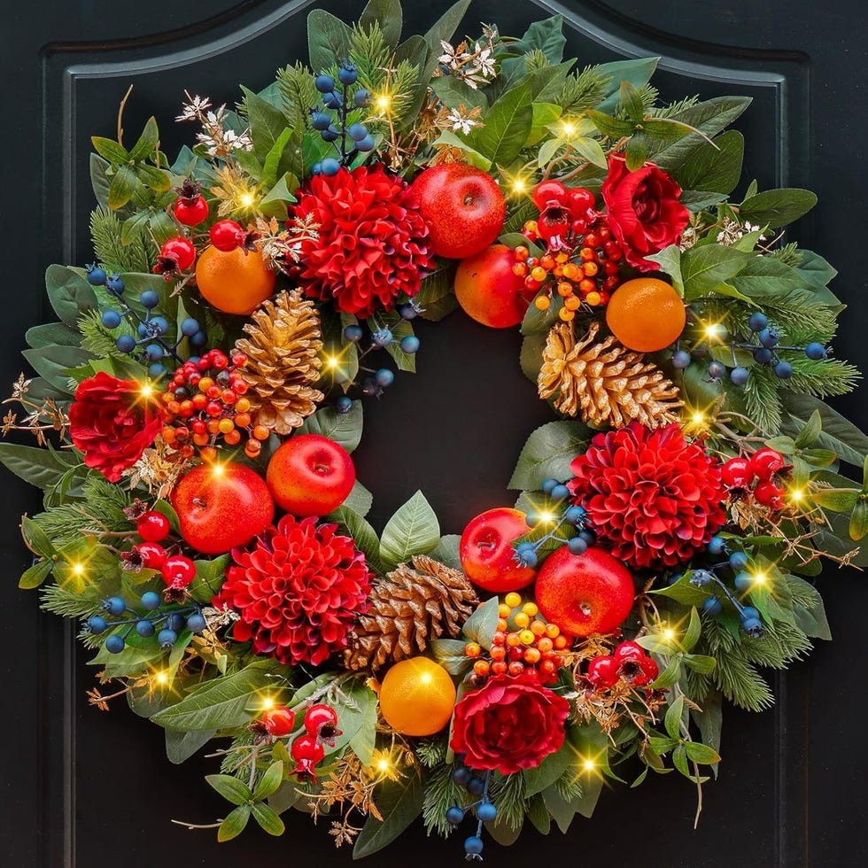 Vibrant Wreath with Red Flowers on a Black Door — Christmas Wreath