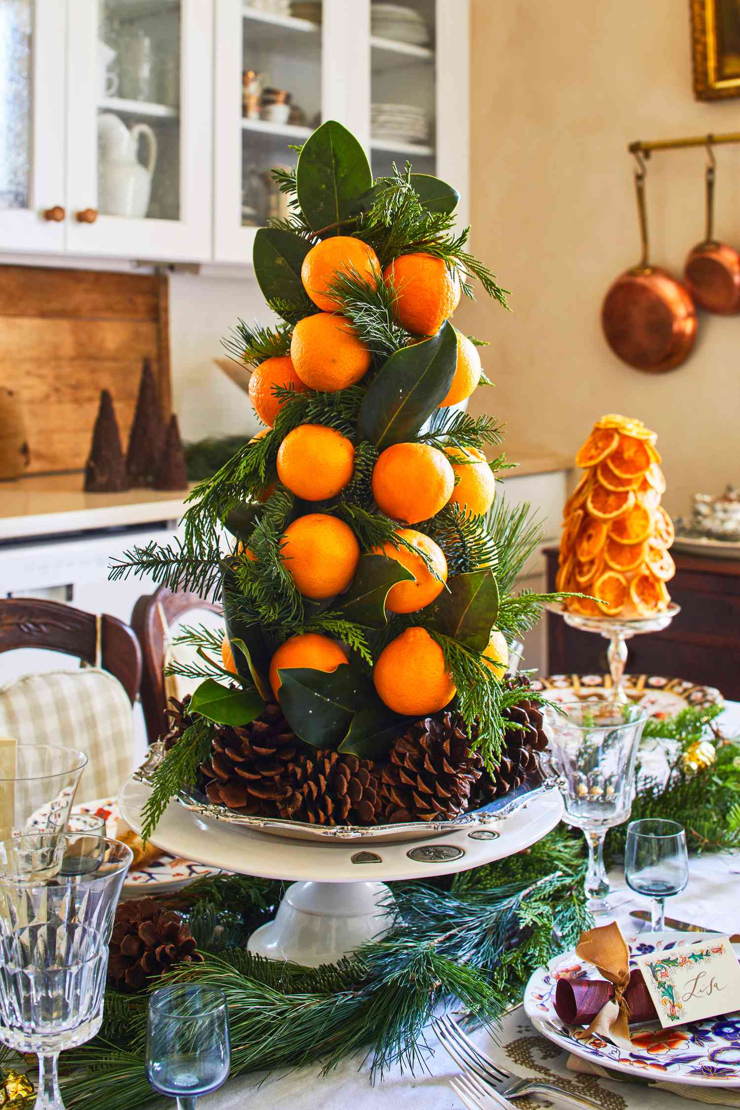 Tiered Orange and Evergreen Centerpiece on Silver Stand — Christmas Centerpiece
