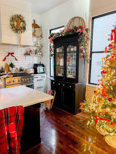 Farmhouse Kitchen Corner Featuring a Large Christmas Tree and Decorated Hutch — Christmas Kitchen Decor