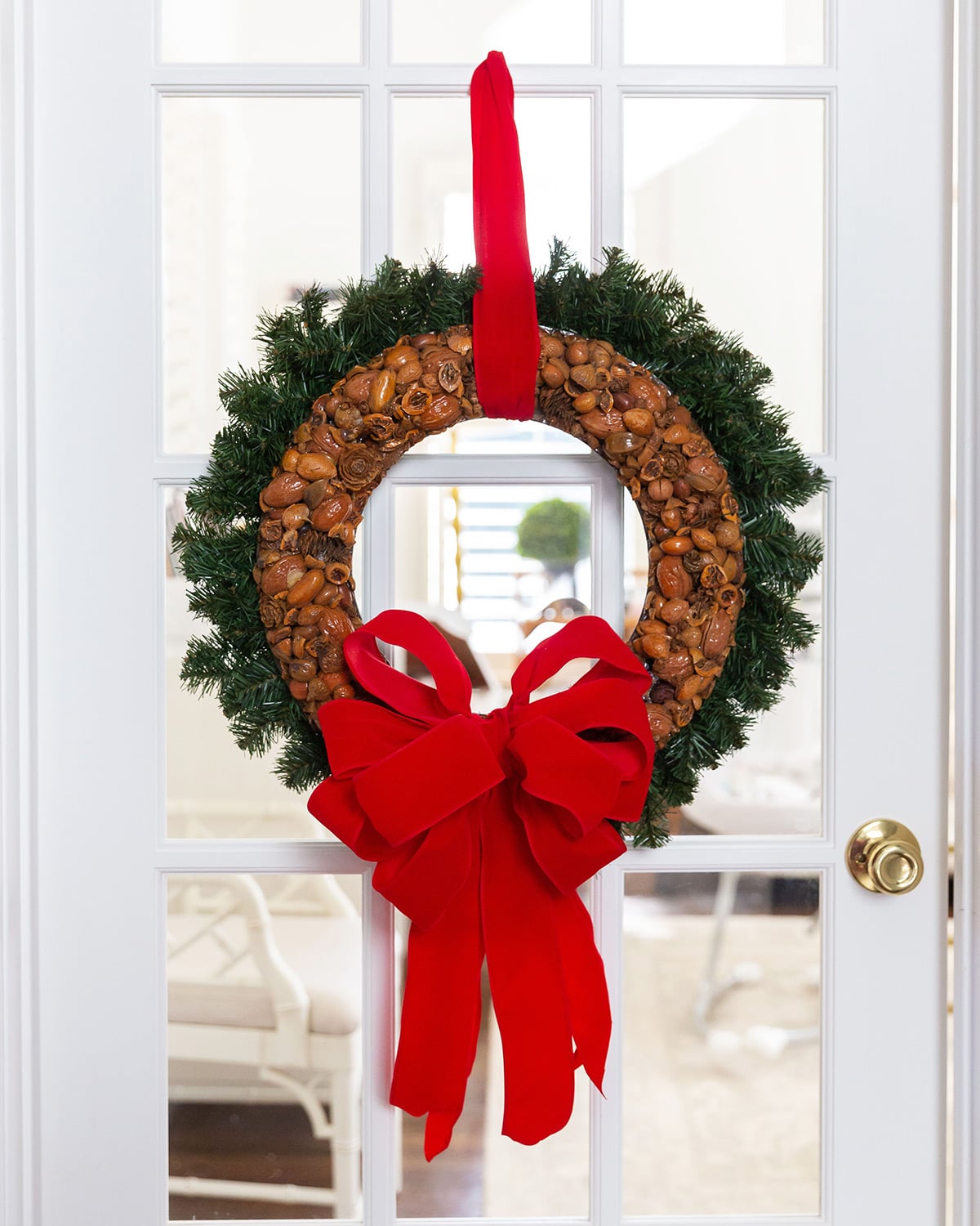 Nut and Greenery Wreath with a Bold Red Velvet Bow — DIY Christmas Wreath