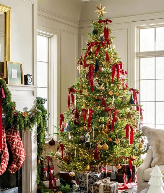 Cozy Living Room Corner with Decorated Tree and Fireplace Garland Cozy Living Room Corner with Decorated Tree and Fireplace Garland — Red and Green Christmas Decor