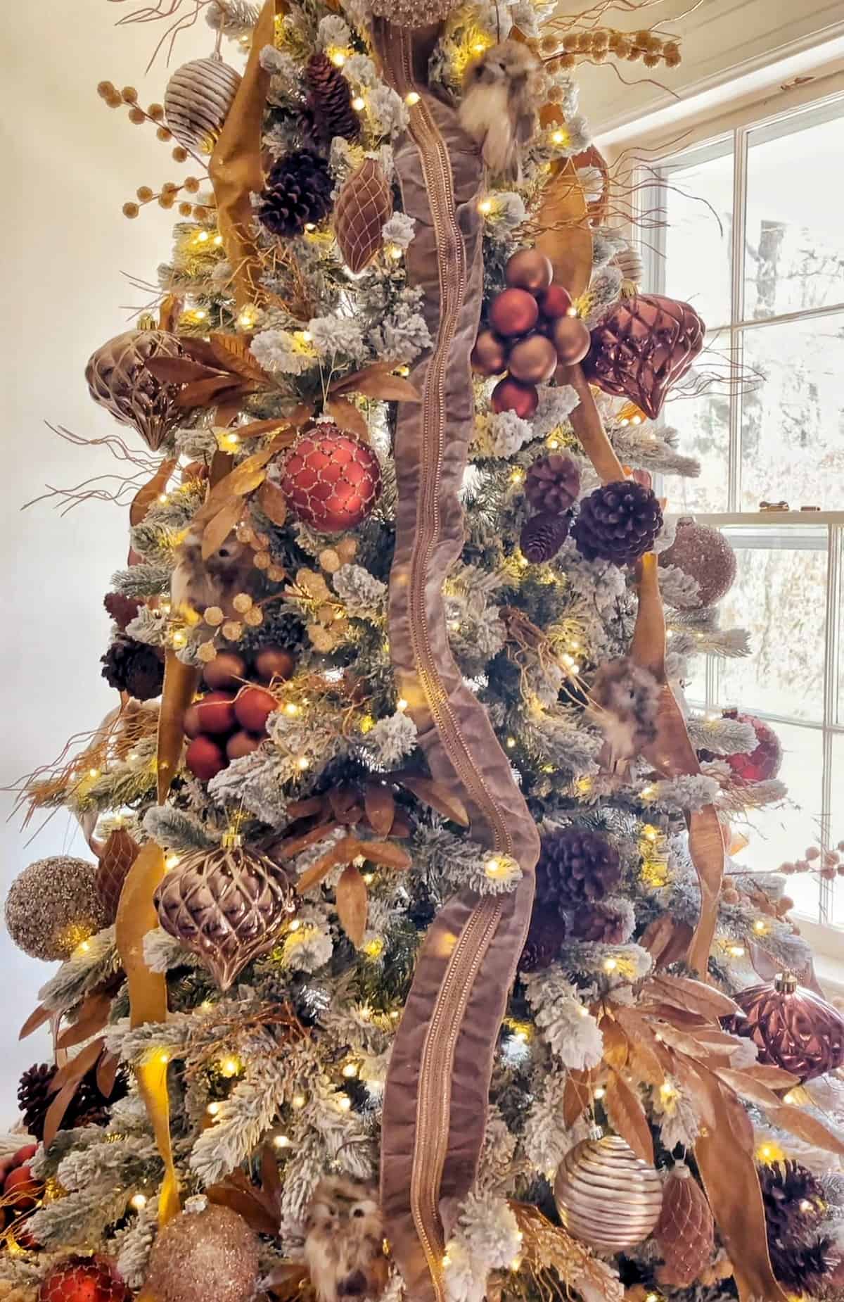 Rustic Woodland Touches: Owl Ornaments and Pinecones on Flocked Tree Rustic Woodland Touches: Owl Ornaments and Pinecones on Flocked Tree — Flocked Christmas Tree Decor