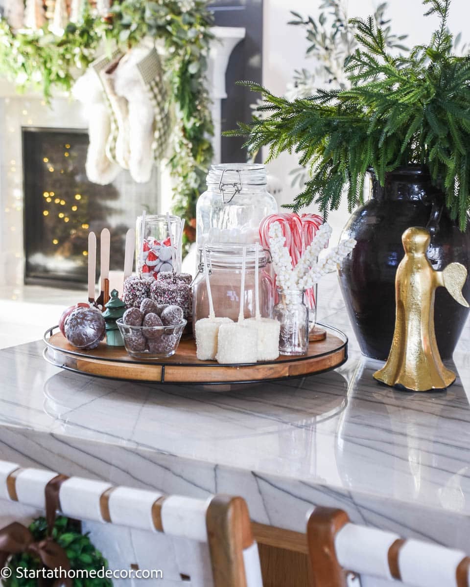 Marble Kitchen Island Hot Cocoa Bar with Angel Figurine — Christmas Hot Cocoa Bar