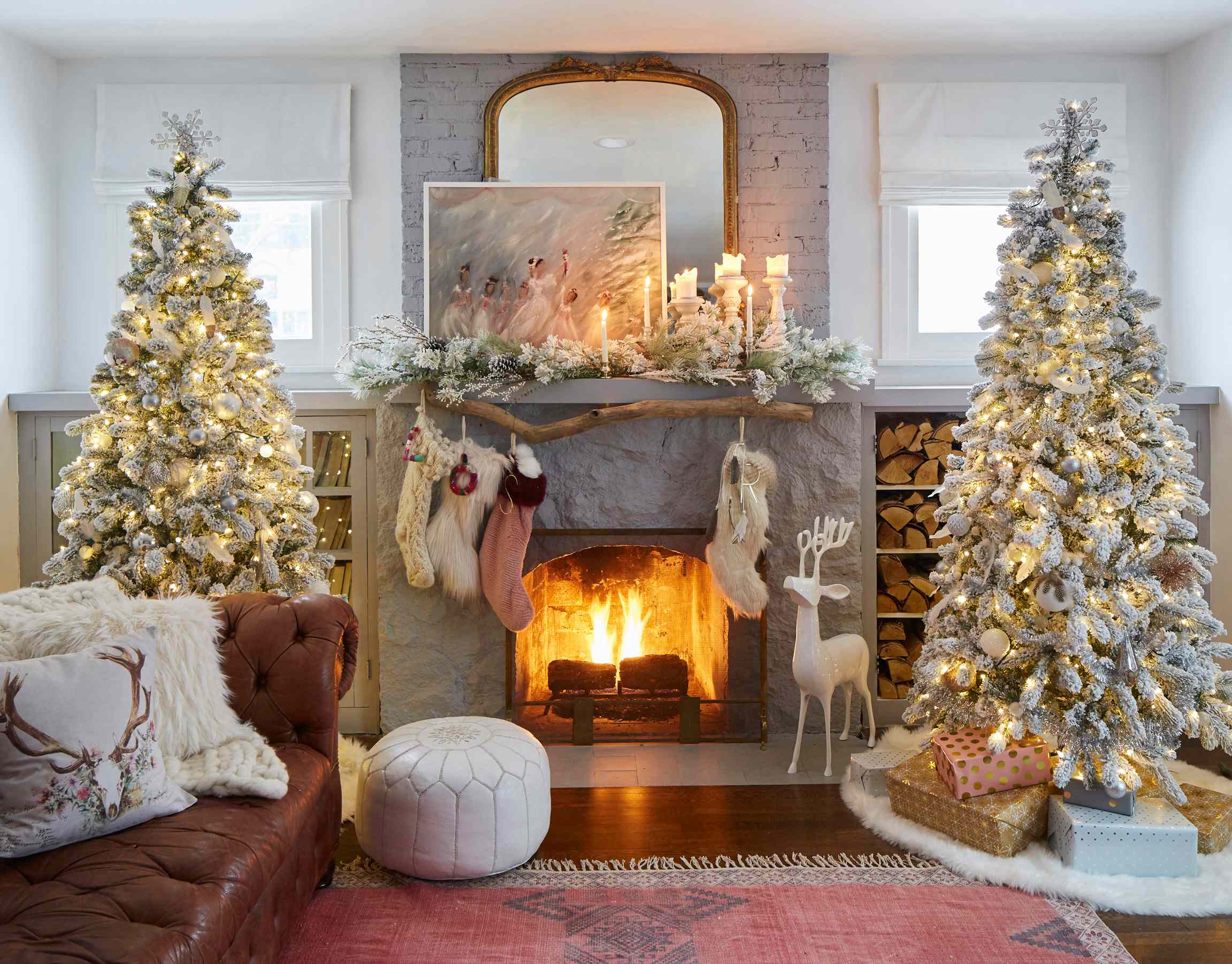 Flocked Christmas Trees Flanking a Stone Fireplace — Winter Wonderland Christmas Decor