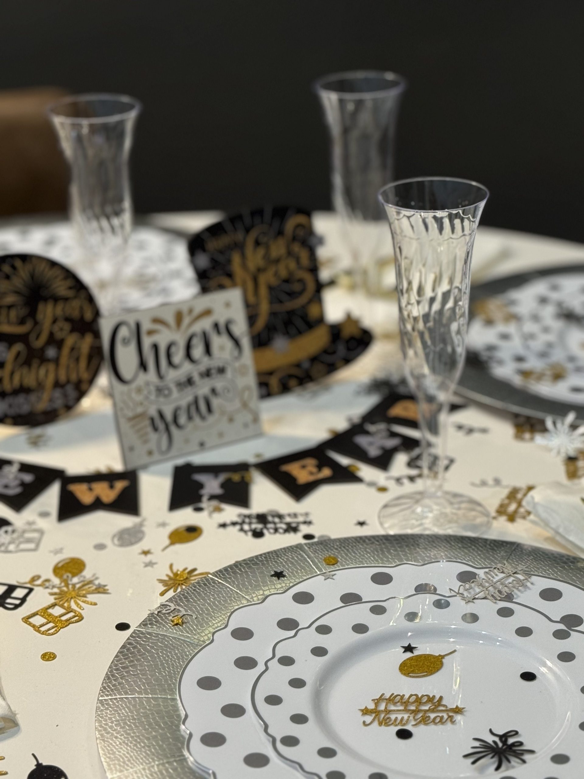 Festive Table Setting with 'Cheers' Card and 'Happy New Year' Party Hats — New Years Eve Party 2027