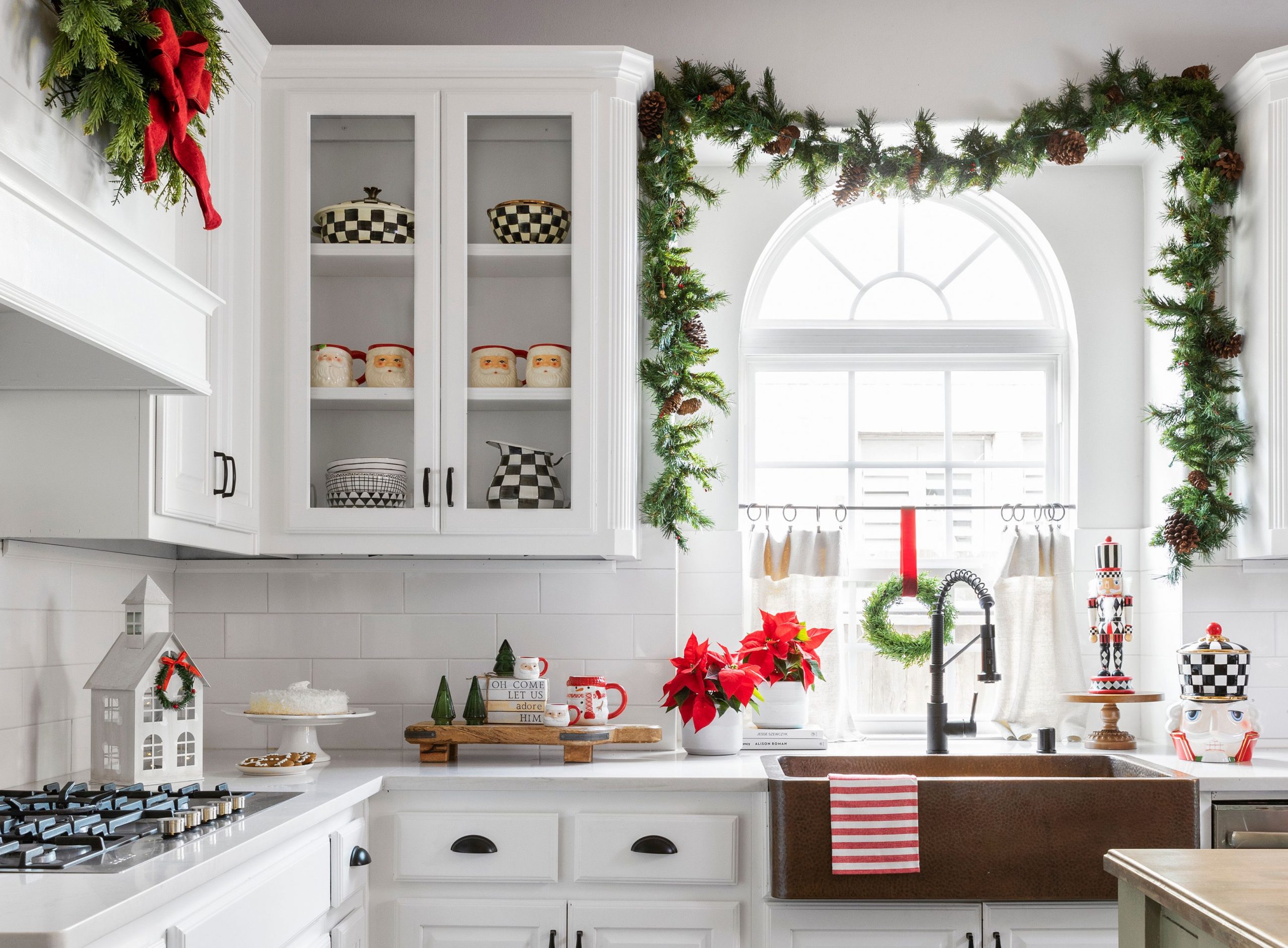Modern Farmhouse Kitchen Sink Area with Abundant Greenery and Poinsettias — Christmas Kitchen Decor