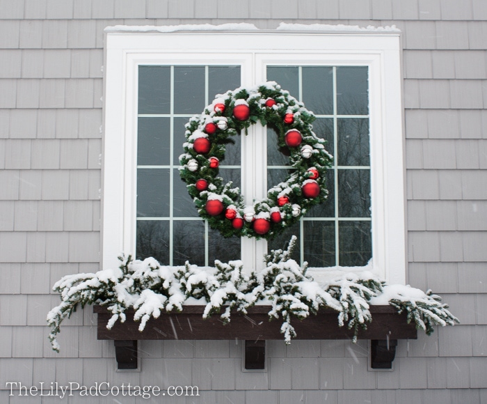 Traditional Window with Large Wreath and Snow-Dusted Window Box Traditional Window with Large Wreath and Snow-Dusted Window Box — Christmas Window Decor Outdoor