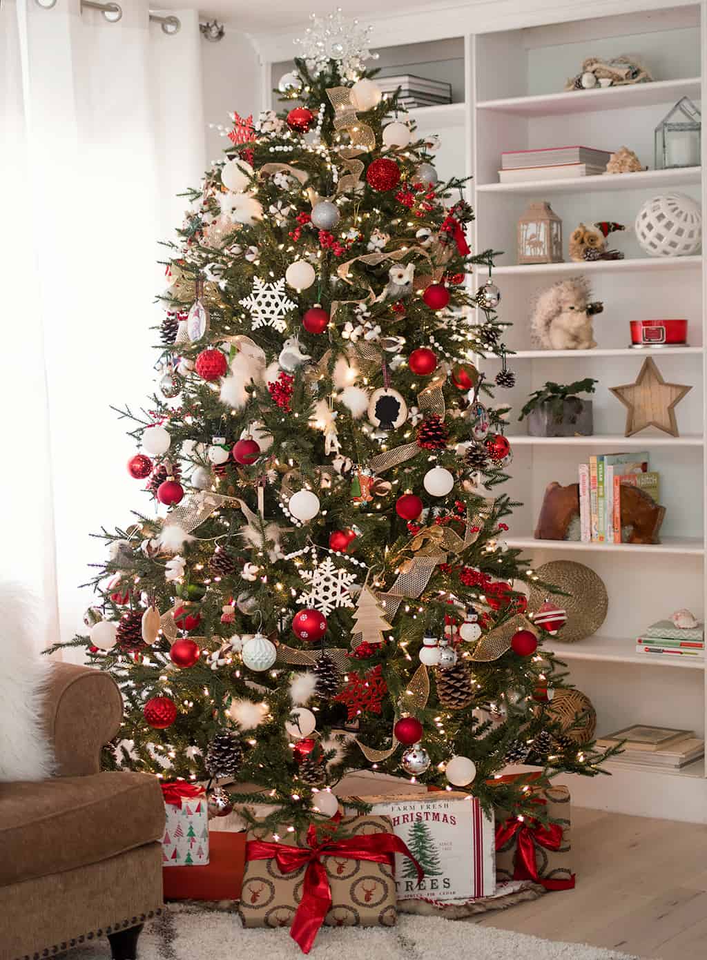 Traditional Tree with Red Ribbon, Gold Baubles, and Pinecones — Christmas Tree Color Schemes