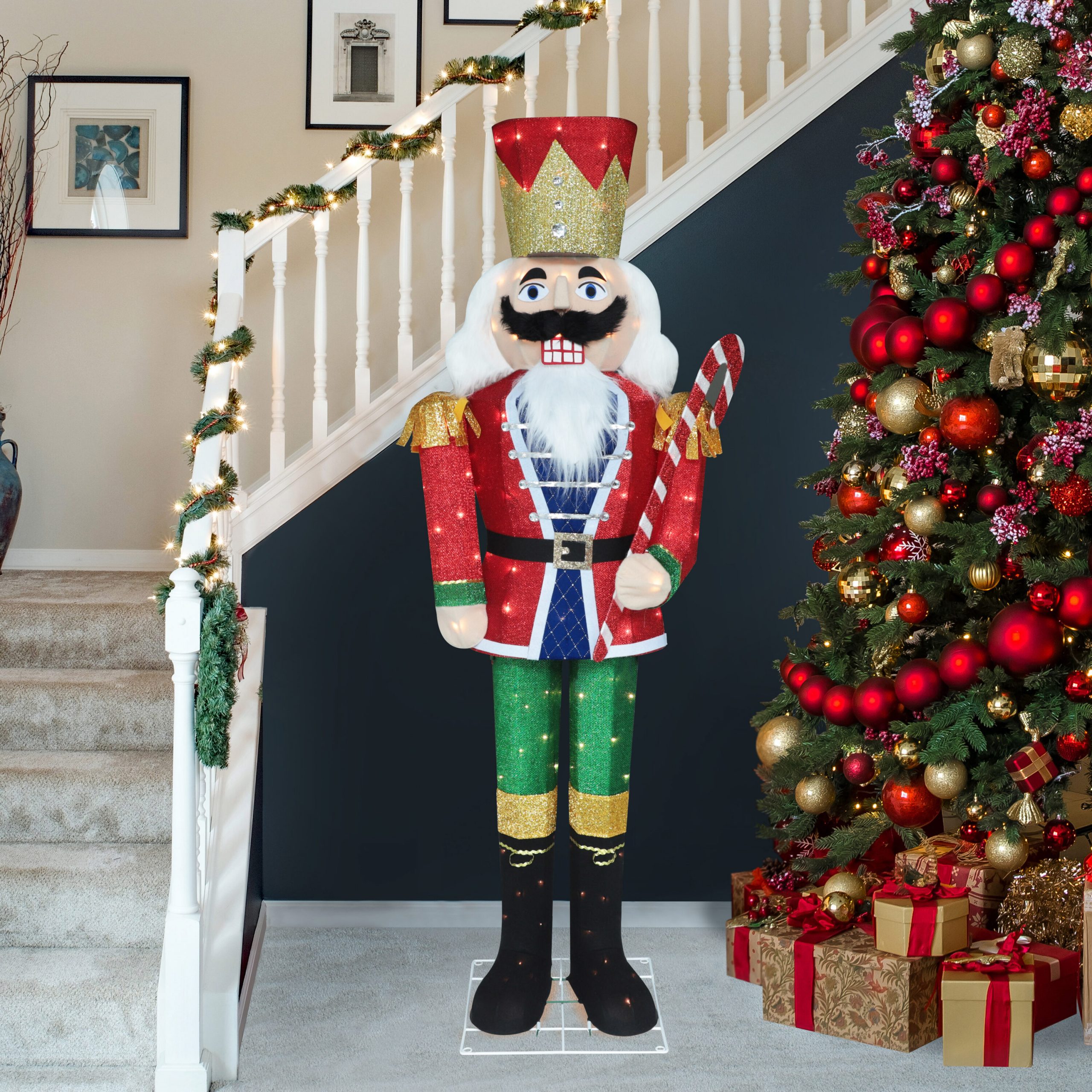 Large Illuminated Nutcracker by a Garlanded Staircase Large Illuminated Nutcracker by a Garlanded Staircase — Nutcracker Christmas Decor