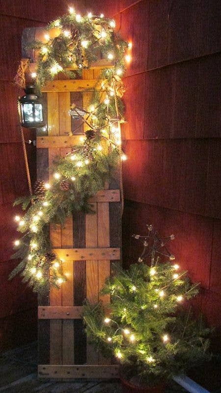 Rustic Wooden Wall with Garland and Lights — Christmas Light Display Ideas
