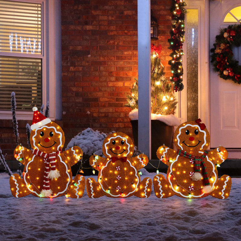 Whimsical Outdoor Display of Lighted Gingerbread Figures — Gingerbread Christmas Decor