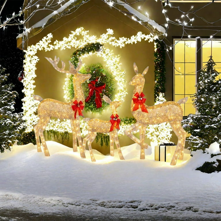 Charming Light-Up Reindeer Family in Snowy Yard — Christmas Light Display Ideas