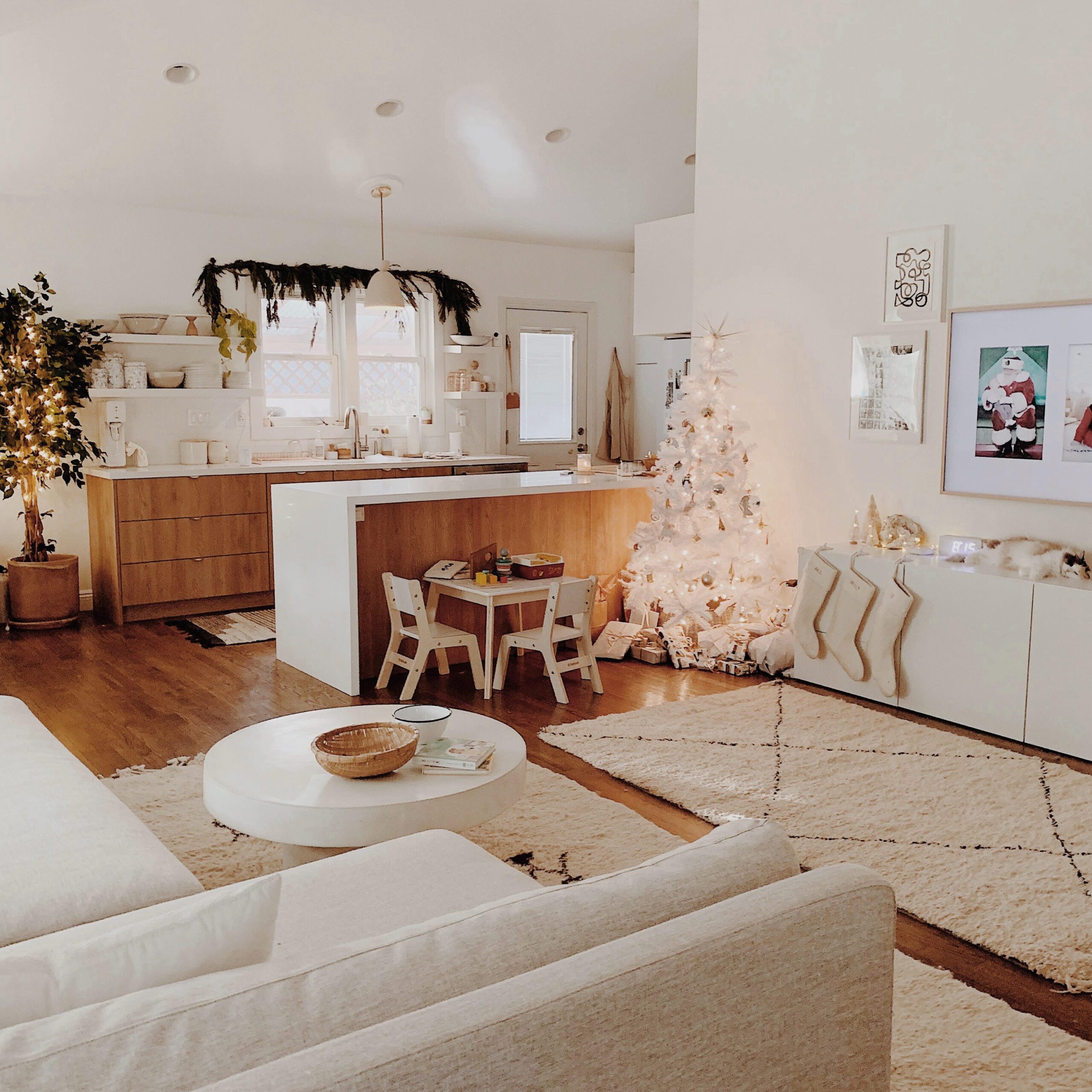 Open-Plan Modern Kitchen and Living Area with White Christmas Tree — Modern Christmas Decor