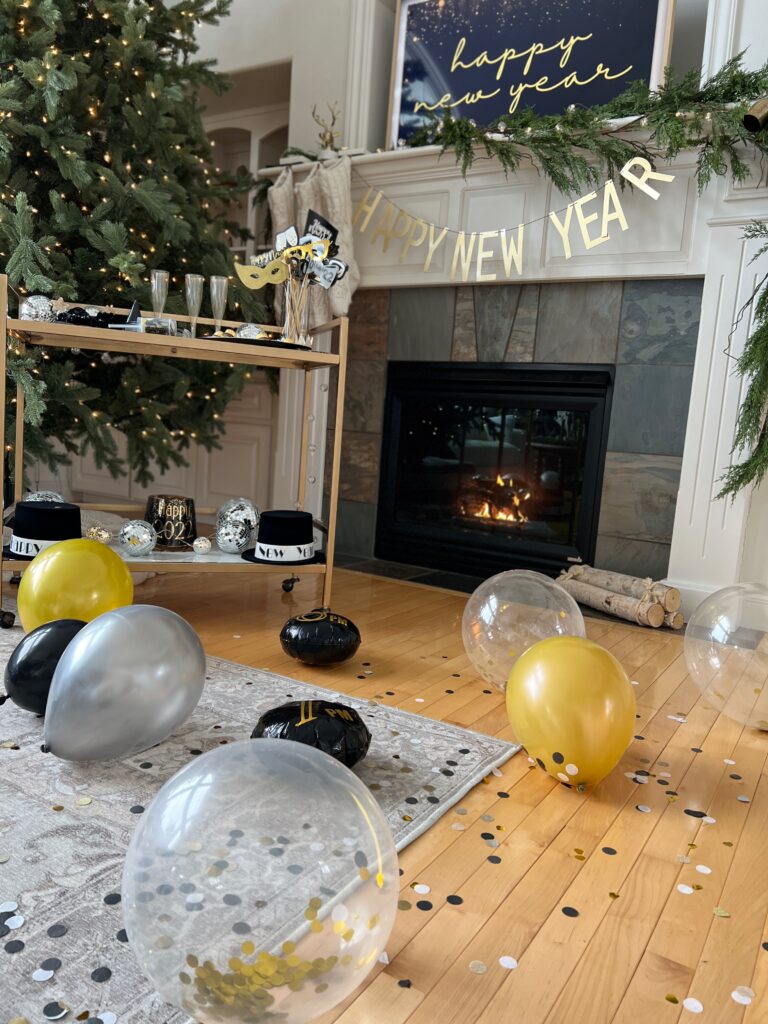 Festive Fireplace Mantle with 'Happy New Year' Banner and Balloons — New Years Eve Party Decor
