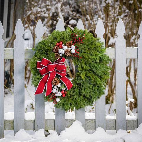 Traditional Wreath with Red Bow on a White Fence — Christmas Wreath