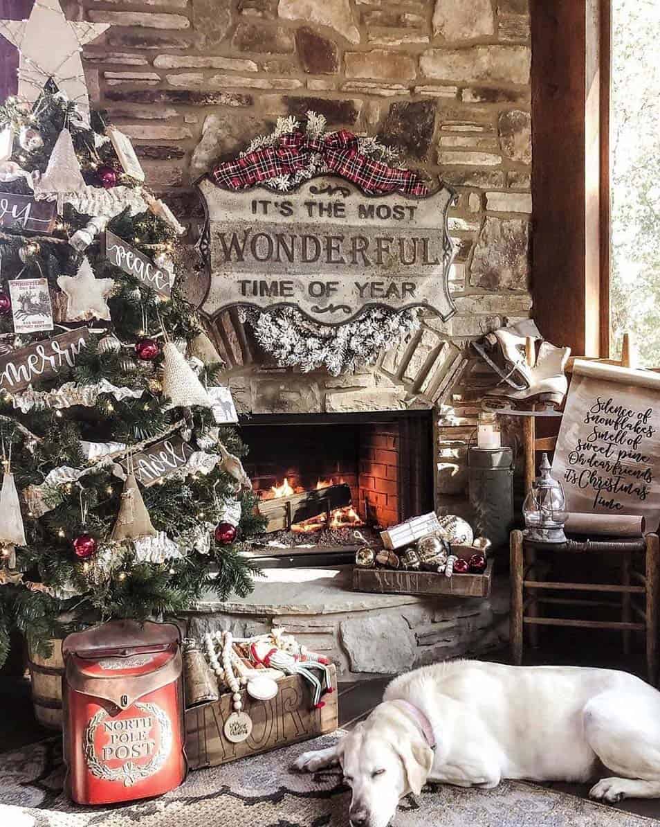 Wide Room Shot Farmhouse Living Room with Plaid Sign by Fireplace — Rustic Christmas Decor
