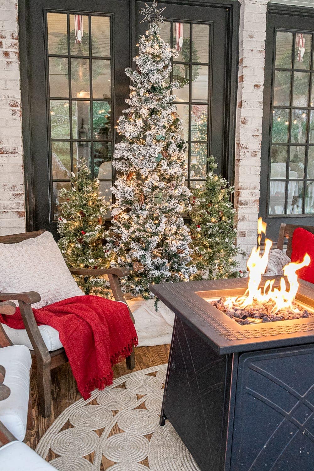 Cozy Outdoor Back Porch with Flocked Trees and Fire Pit Cozy Outdoor Back Porch with Flocked Trees and Fire Pit — Cozy Christmas Decor