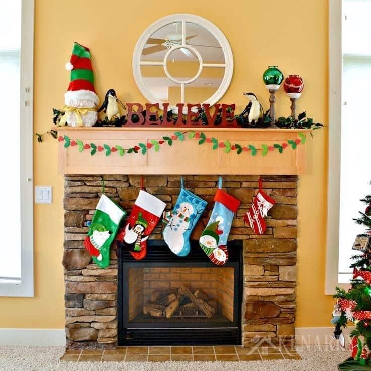 Traditional Fireplace with Colorful Stockings and 'BELIEVE' Sign Traditional Fireplace with Colorful Stockings and 'BELIEVE' Sign — Christmas Fireplace Decor
