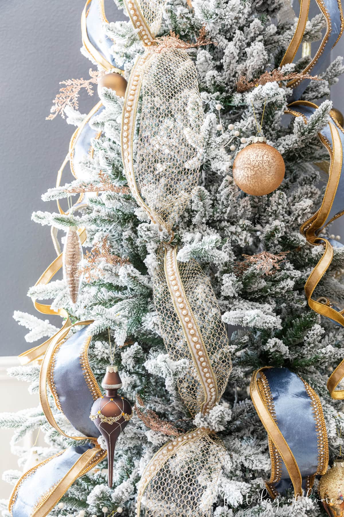 Glamorous Flocked Christmas Tree with Blue Velvet Ribbon — Christmas Tree Decorating