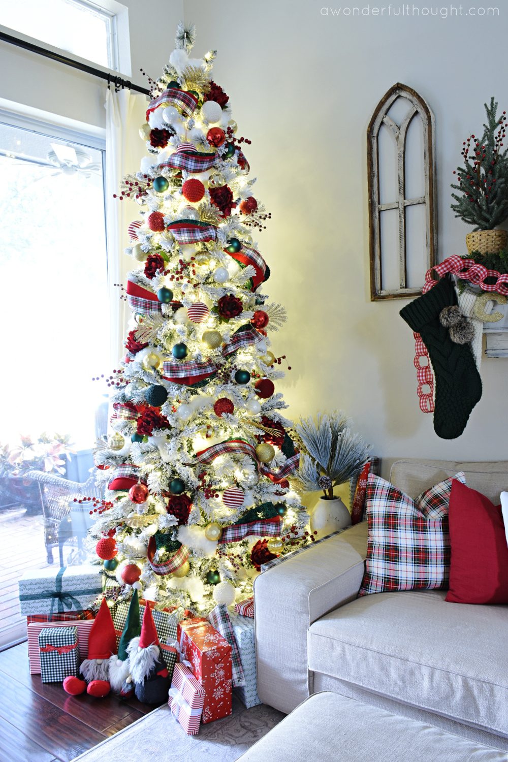 Flocked Christmas Tree with Red and Green Accents in a Cozy Corner Flocked Christmas Tree with Red and Green Accents in a Cozy Corner — Red and Green Christmas Decor