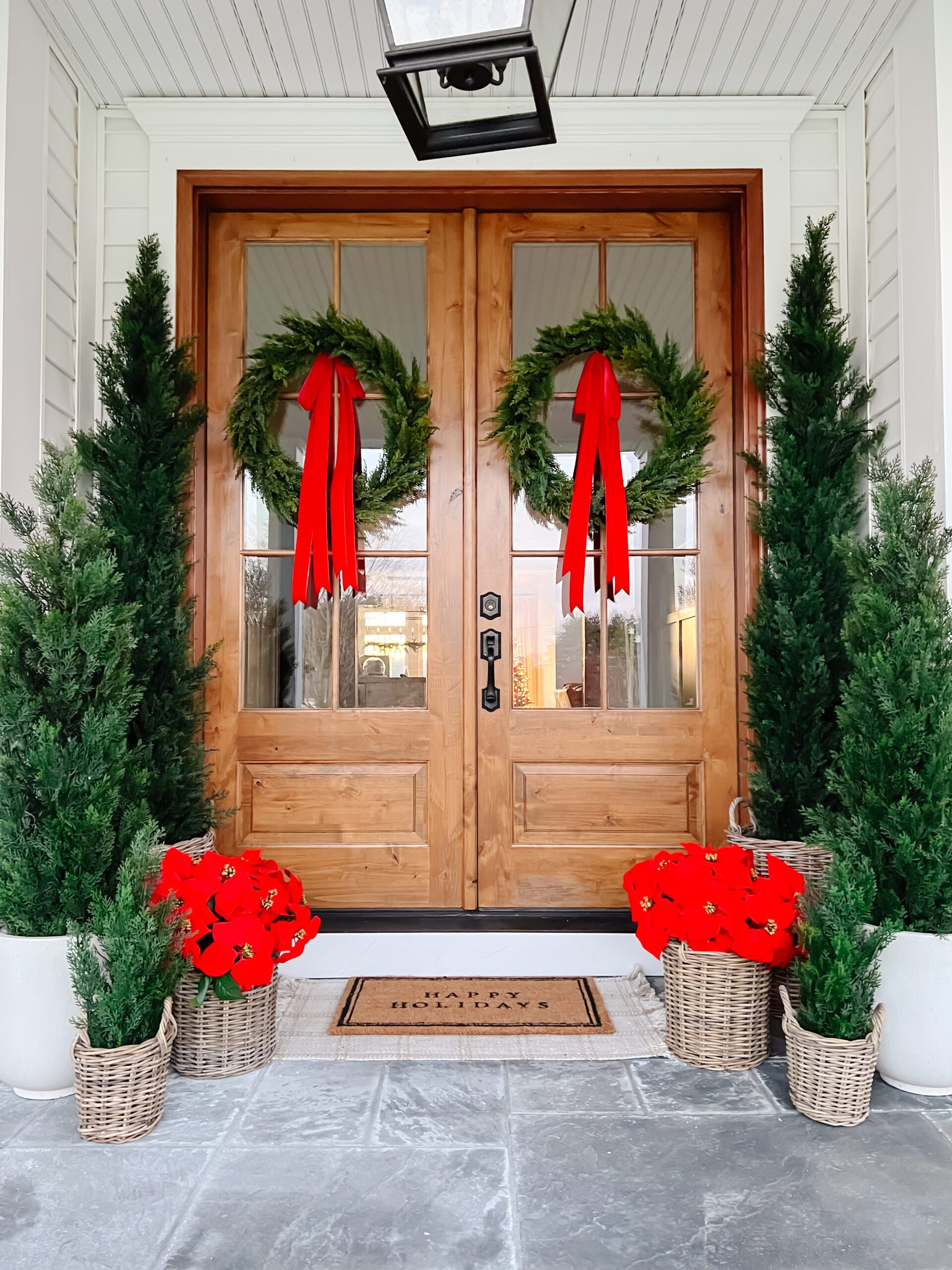 Grand Double Doors with Lush Wreaths and Poinsettias Grand Double Doors with Lush Wreaths and Poinsettias — Christmas Front Door Decor