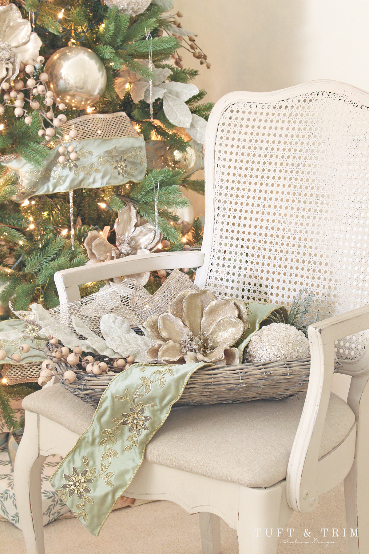 Elegant Christmas Decor in a Wicker Basket on a Chair Elegant Christmas Decor in a Wicker Basket on a Chair — Sage Green Christmas Decor