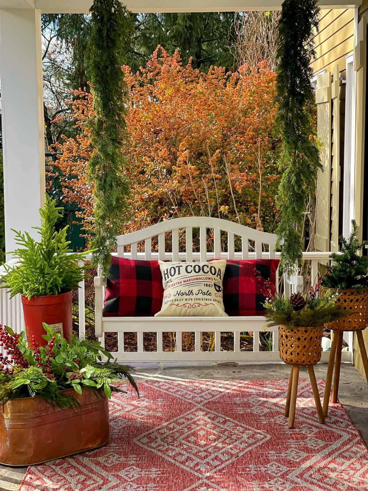 Farmhouse Porch Swing with Buffalo Check Pillows Farmhouse Porch Swing with Buffalo Check Pillows — Christmas Porch Decor