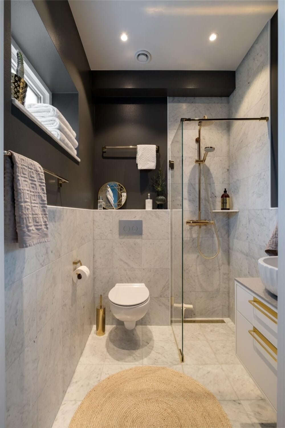 Compact Modern Shower with Gold Fixtures and Marble Tile — Shower Room Ideas