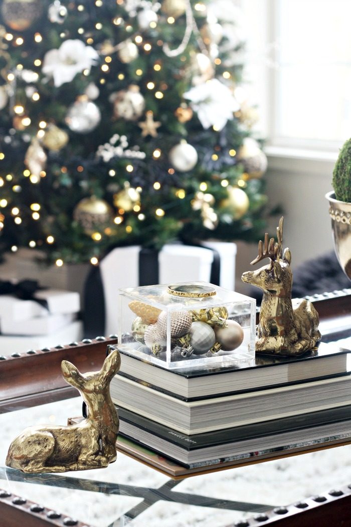 Glam Coffee Table Stack with Ornaments and Brass Deer Glam Coffee Table Stack with Ornaments and Brass Deer — Christmas Coffee Table Decor