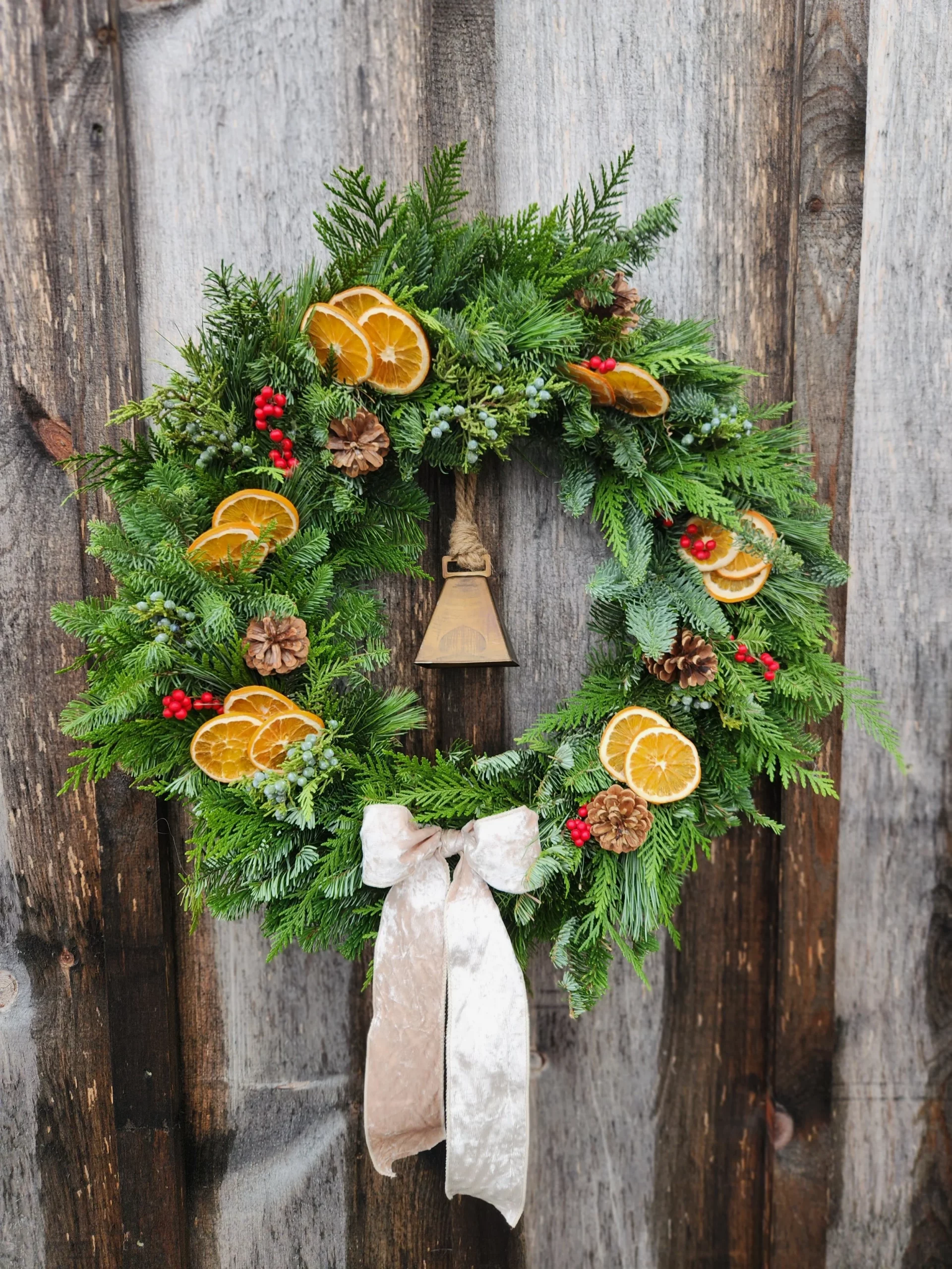 Rustic Wreath with Dried Oranges, Pinecones, and a Vintage Bell — DIY Christmas Wreath