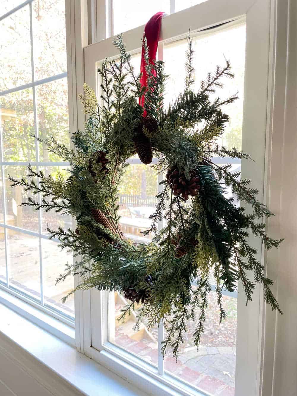 Natural Wreath Hanging on a Window Pane — Christmas Wreath