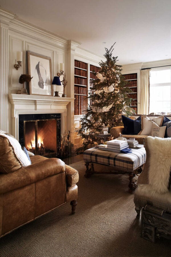 Traditional Living Room with Leather Sofas and Plaid Ottoman Traditional Living Room with Leather Sofas and Plaid Ottoman — Aesthetic Christmas Decor