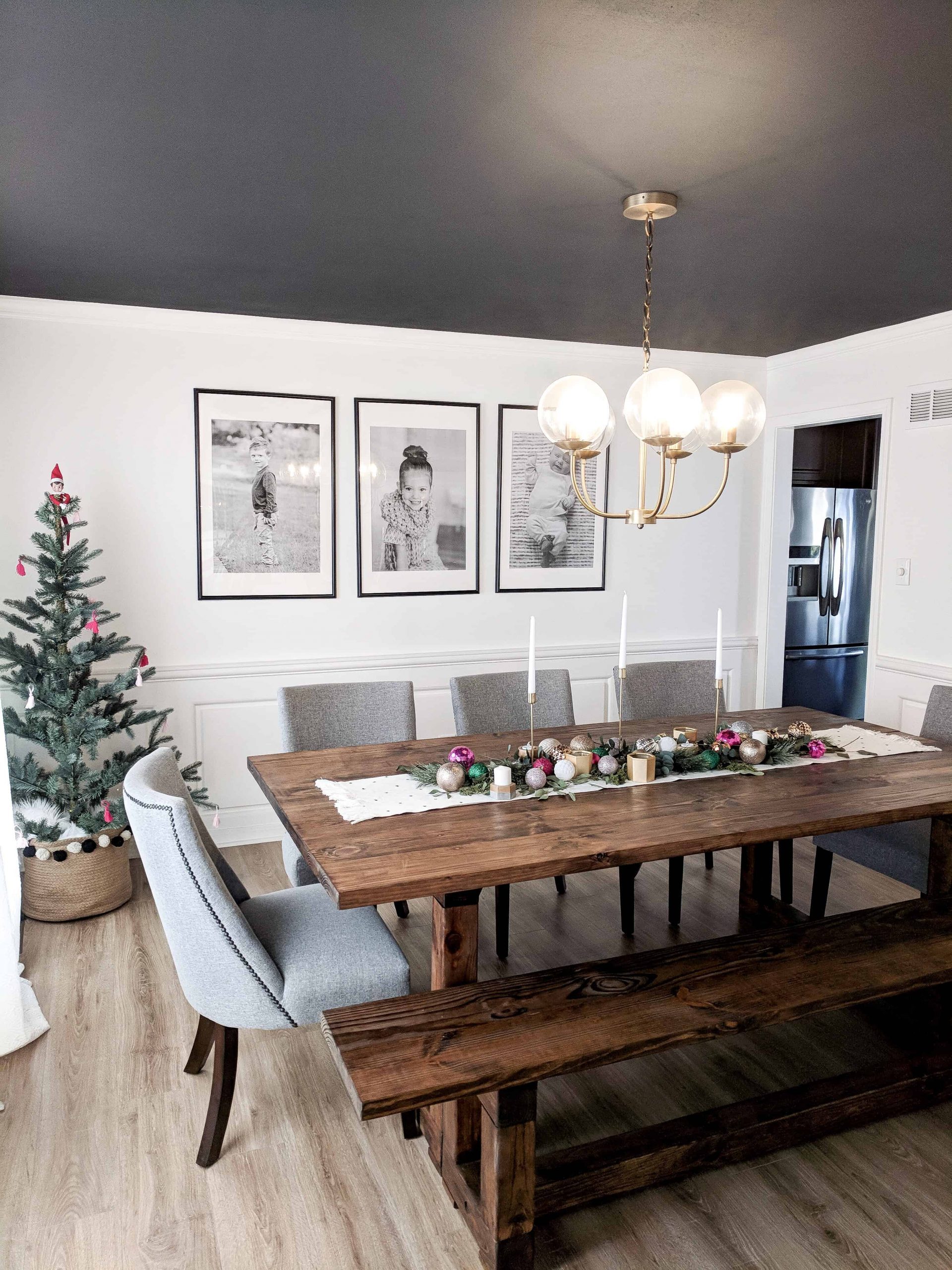 Modern Farmhouse Dining with a Rustic Table and Small Christmas Tree — Christmas Dining Room Decor