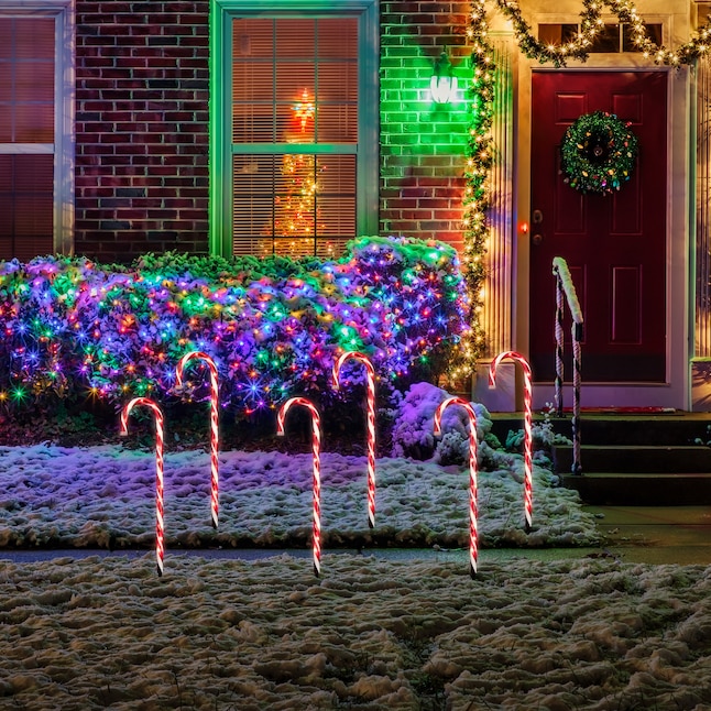 Candy Cane Light Display on Snowy Lawn — Christmas Light Display Ideas