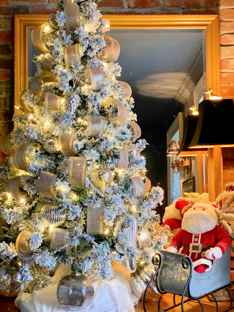 Farmhouse Vignette with a Flocked White Tree, Santa Figure, and Sleigh Farmhouse Vignette with a Flocked White Tree, Santa Figure, and Sleigh — White Christmas Decor