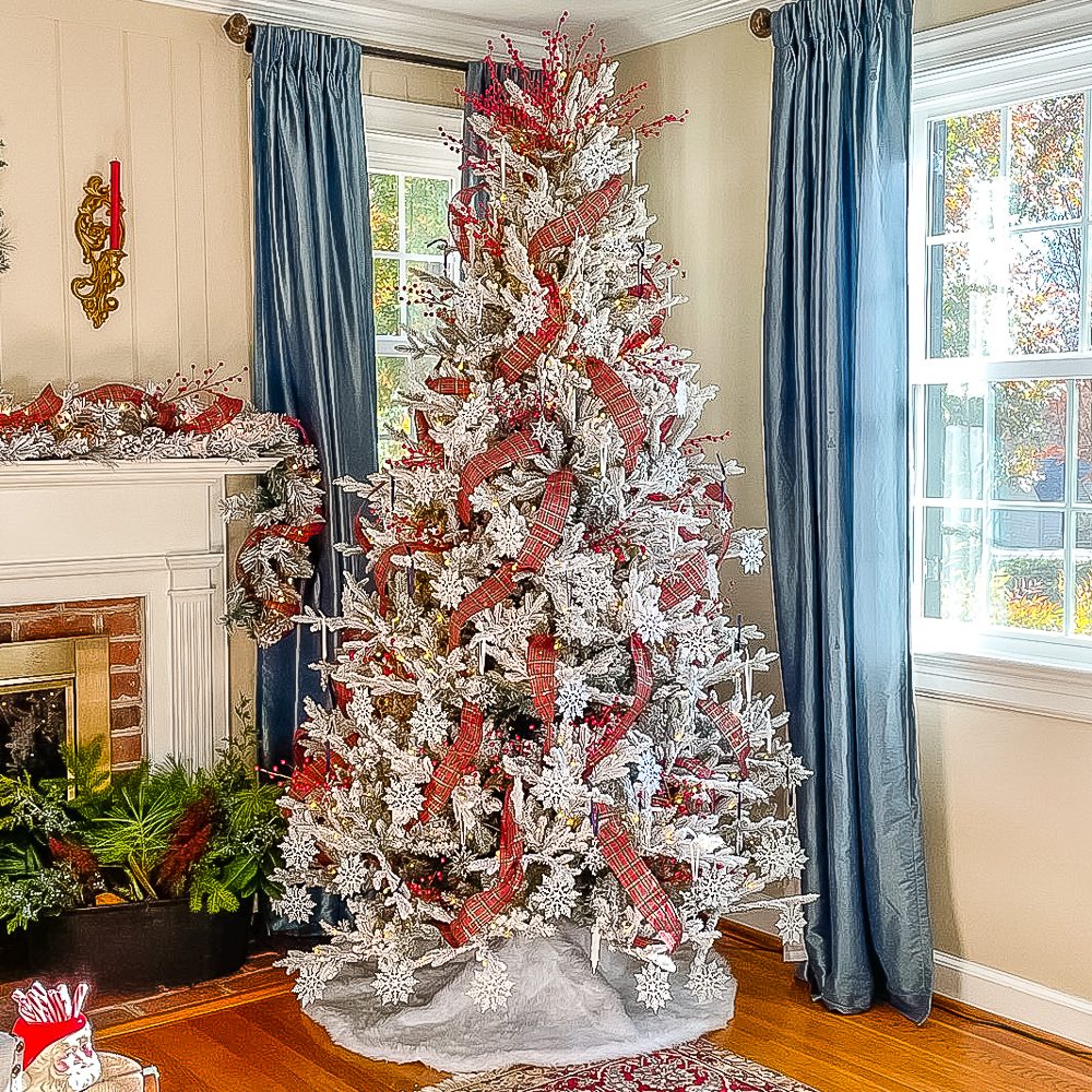 Classic Holiday: Red Plaid Ribbons and Snowflakes on Flocked Tree Classic Holiday: Red Plaid Ribbons and Snowflakes on Flocked Tree — Flocked Christmas Tree Decor