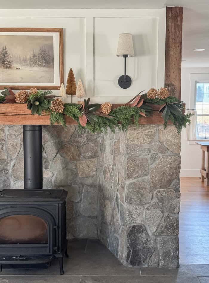 Rustic Fireplace with Integrated Wood Stove and Greenery Garland Rustic Fireplace with Integrated Wood Stove and Greenery Garland — Christmas Fireplace Decor