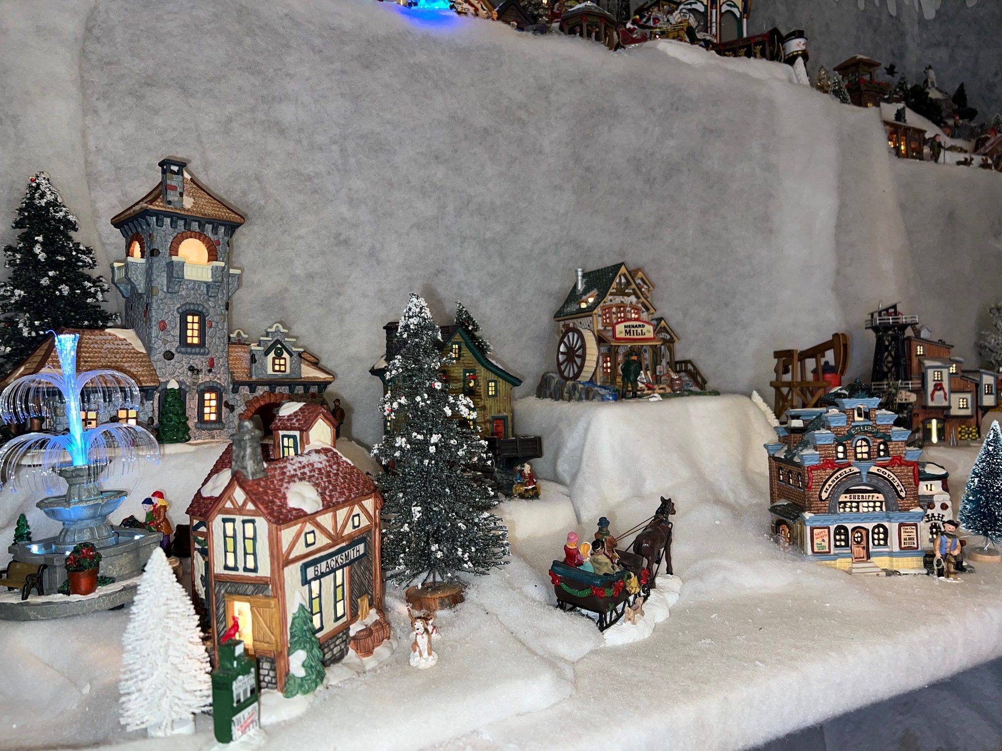 Multi-Tiered Village with a Festive Sleigh Scene Multi-Tiered Village with a Festive Sleigh Scene — Christmas Village Display