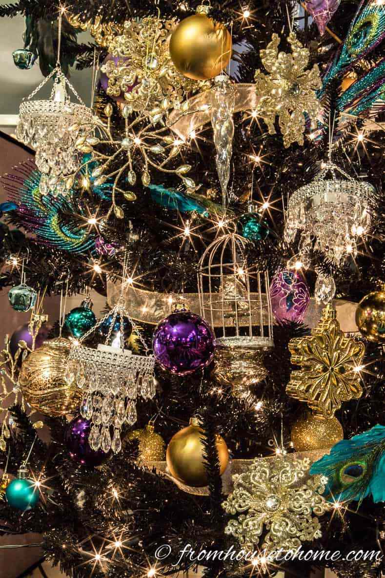 Glamorous Black Tree with Jewel-Toned Ornaments and Fairy Lights Glamorous Black Tree with Jewel-Toned Ornaments and Fairy Lights — Christmas Tree with Colored Lights