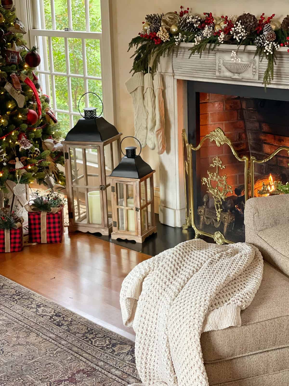 Ornate Farmhouse Fireplace with Festive Stockings and Lanterns — Farmhouse Christmas Decor