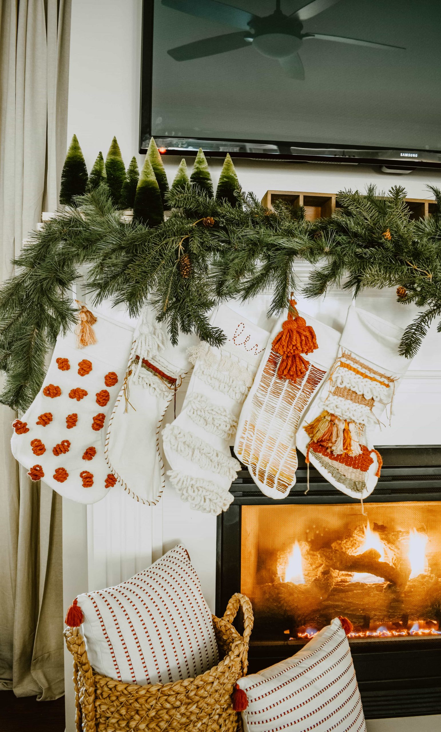 Stockings Hung On A Fireplace Mantle Visual Idea — Boho Christmas Decor