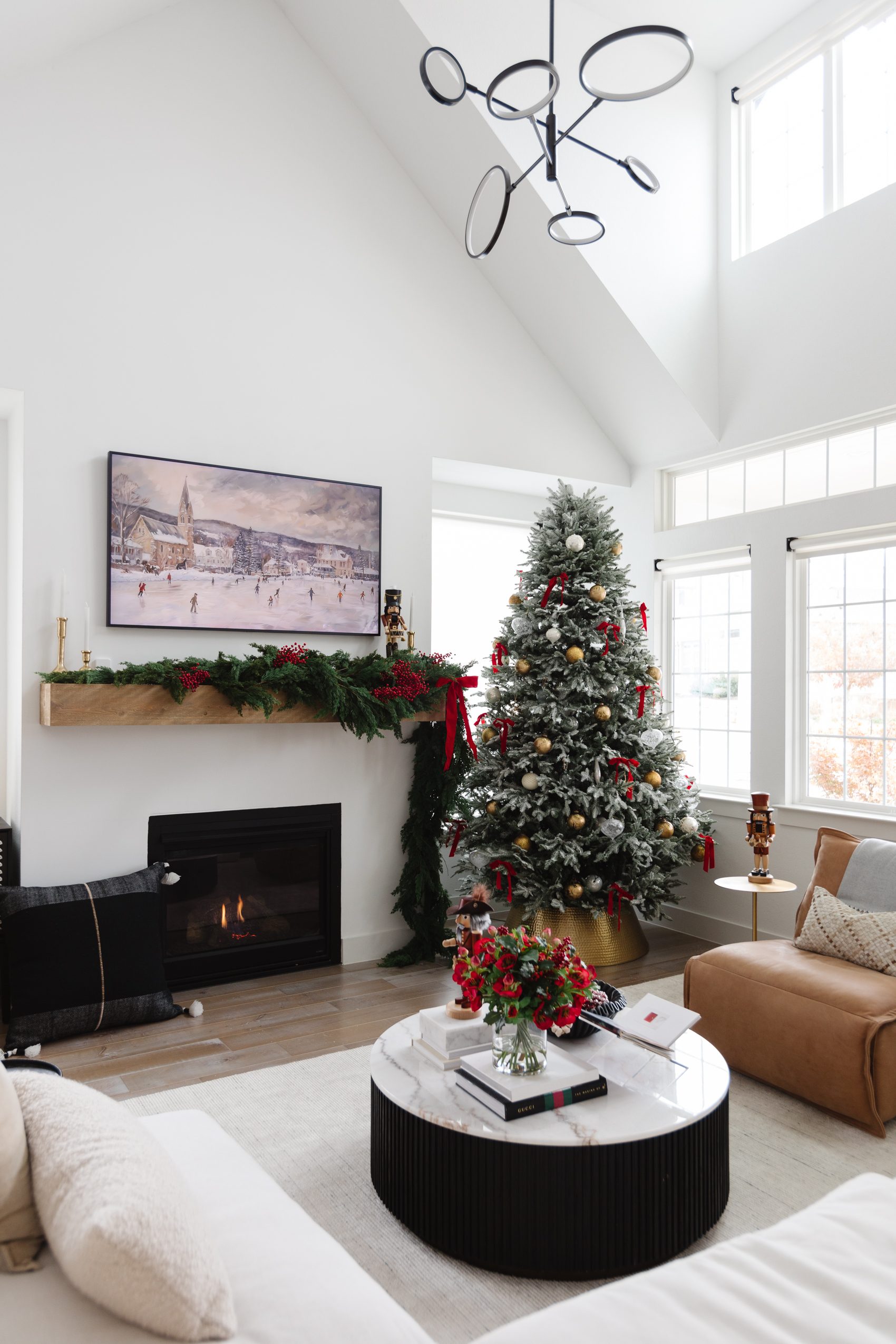 Modern Flocked Tree with Red Ribbon in Open-Plan Living Space — Christmas Decor