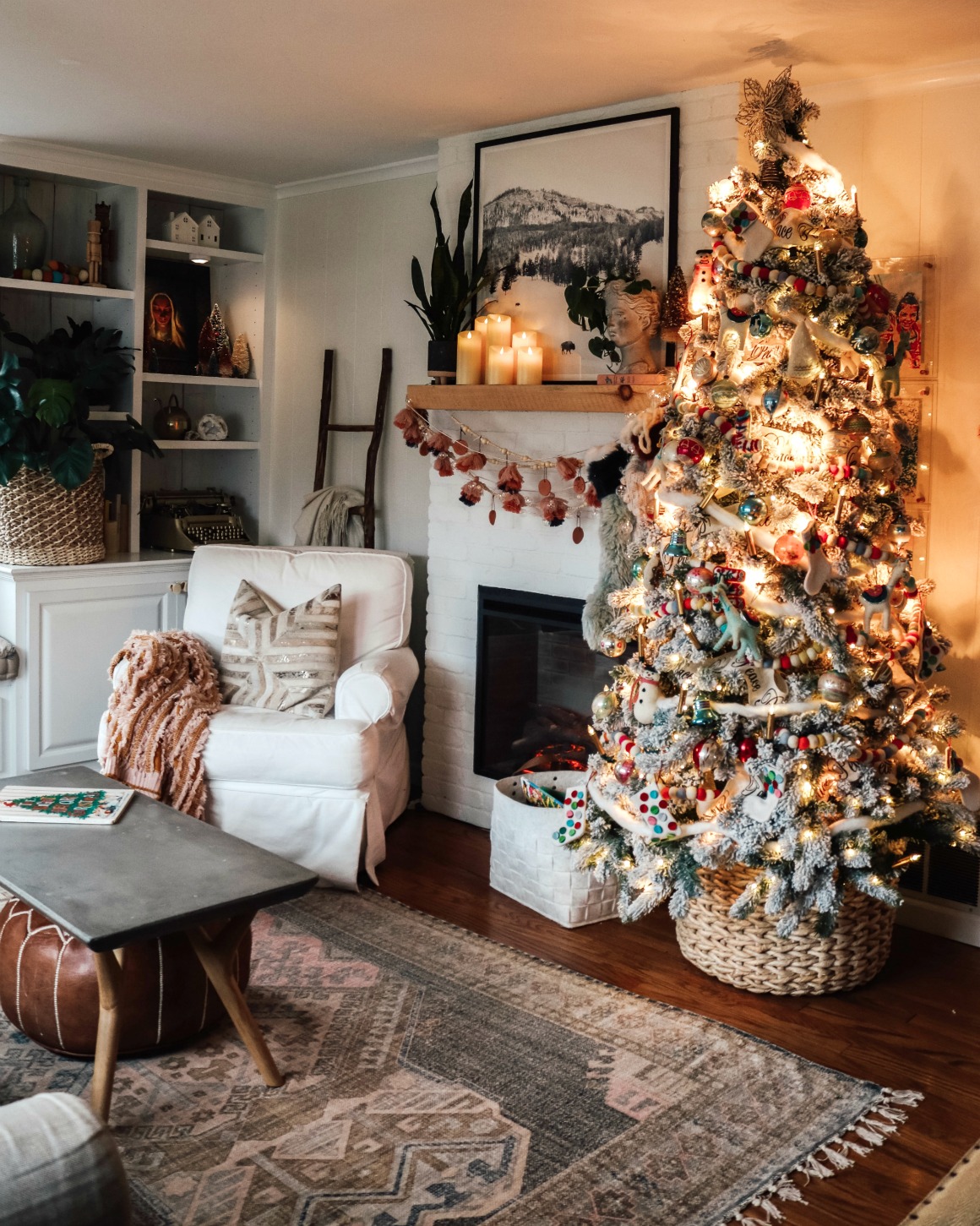 Cozy Living Room with a Warmly Lit Flocked Christmas Tree Cozy Living Room with a Warmly Lit Flocked Christmas Tree — Christmas Living Room Decor