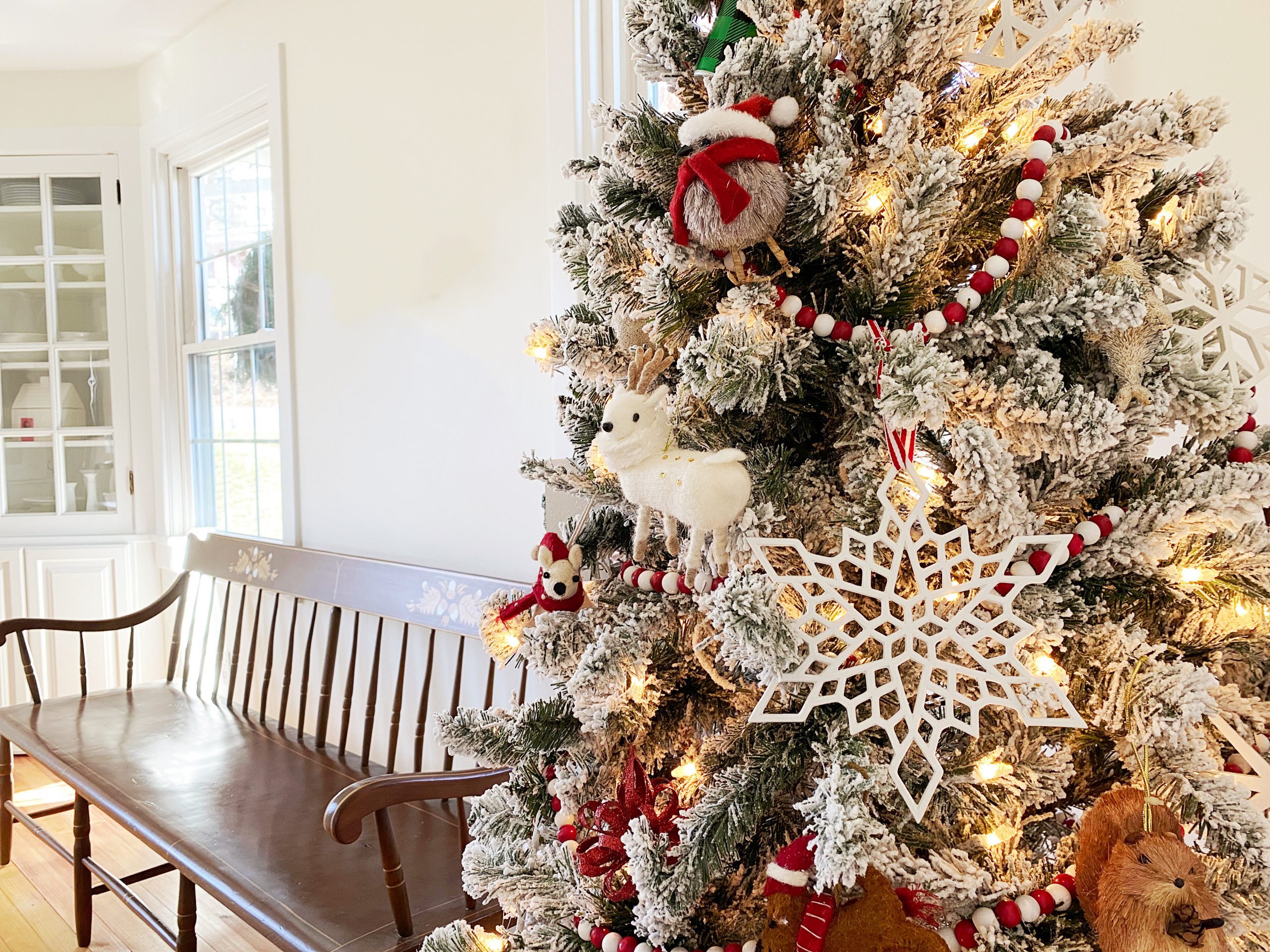 Rustic Touches: Red and White Beaded Garlands on Flocked Tree Rustic Touches: Red and White Beaded Garlands on Flocked Tree — Flocked Christmas Tree Decor
