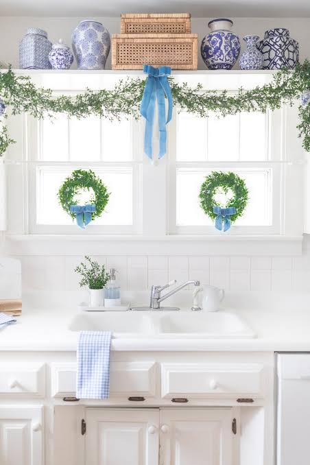 Coastal Kitchen Window and Sink Area with Green Wreaths and Garland — Christmas Kitchen Decor