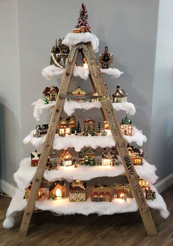 Eclectic Ladder Display Mimicking a Christmas Tree Eclectic Ladder Display Mimicking a Christmas Tree — Christmas Village Display