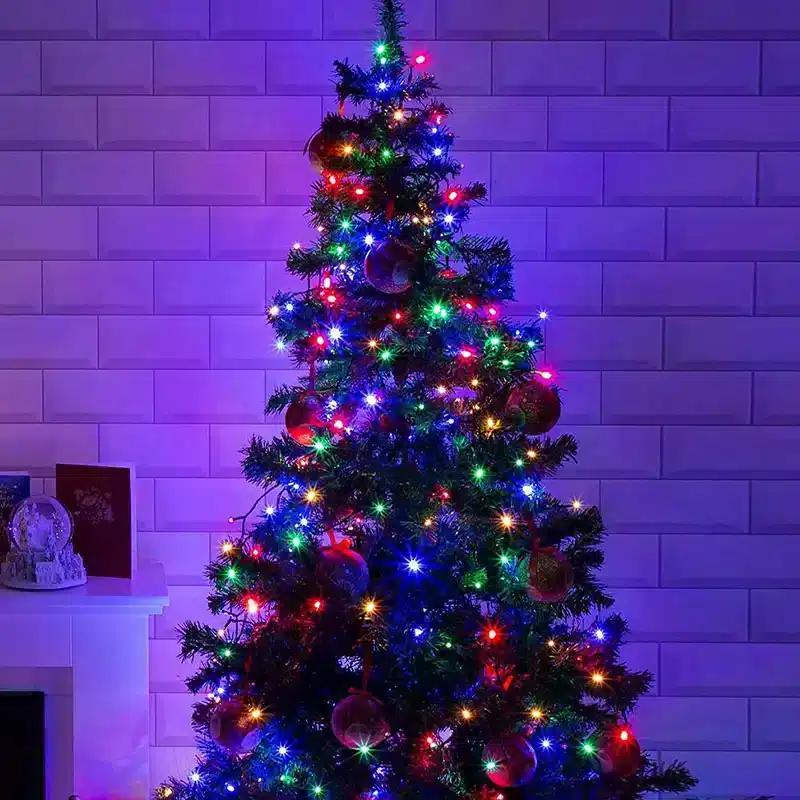 Multicolor Lights on a Christmas Tree with Purple Accent — Christmas Lights Indoor
