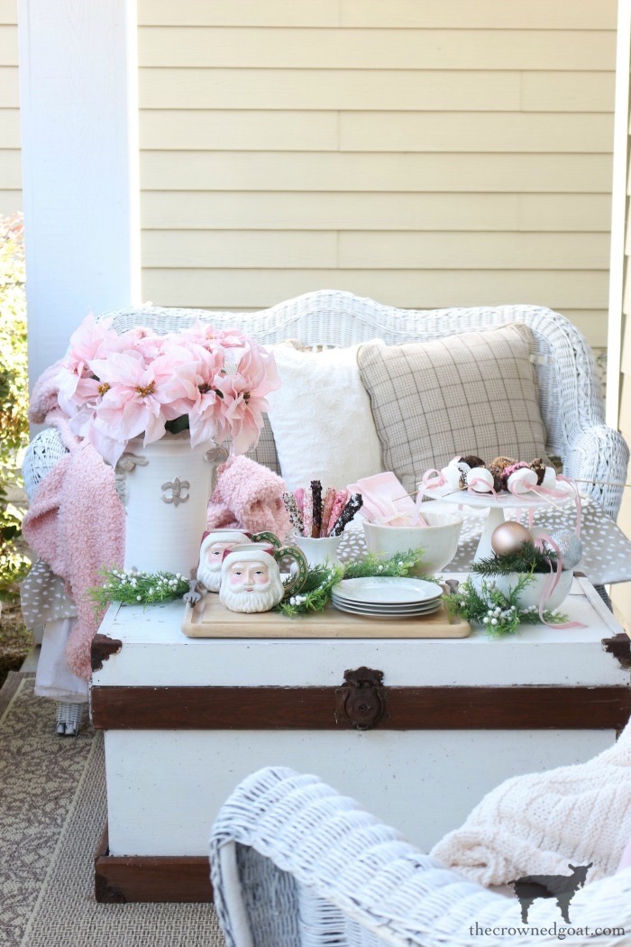 Romantic Porch Seating with Wicker Furniture and Pink Poinsettias — Farmhouse Christmas Porch