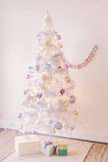 Living Room Whimsical White Christmas Tree with Pastel Ornaments and Bows — White Christmas Tree Decor